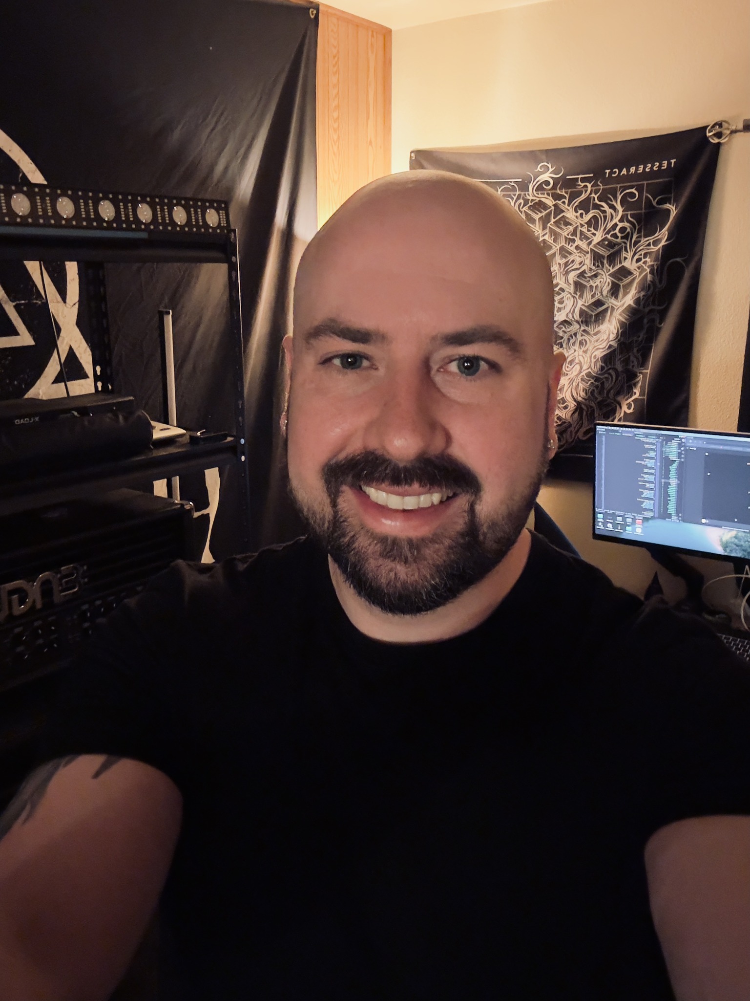 Mark Waldron smiling in his coding workspace